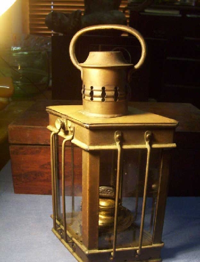 Antique Kerosene Lanterns on Antique Brass Maritime Oil Lamp